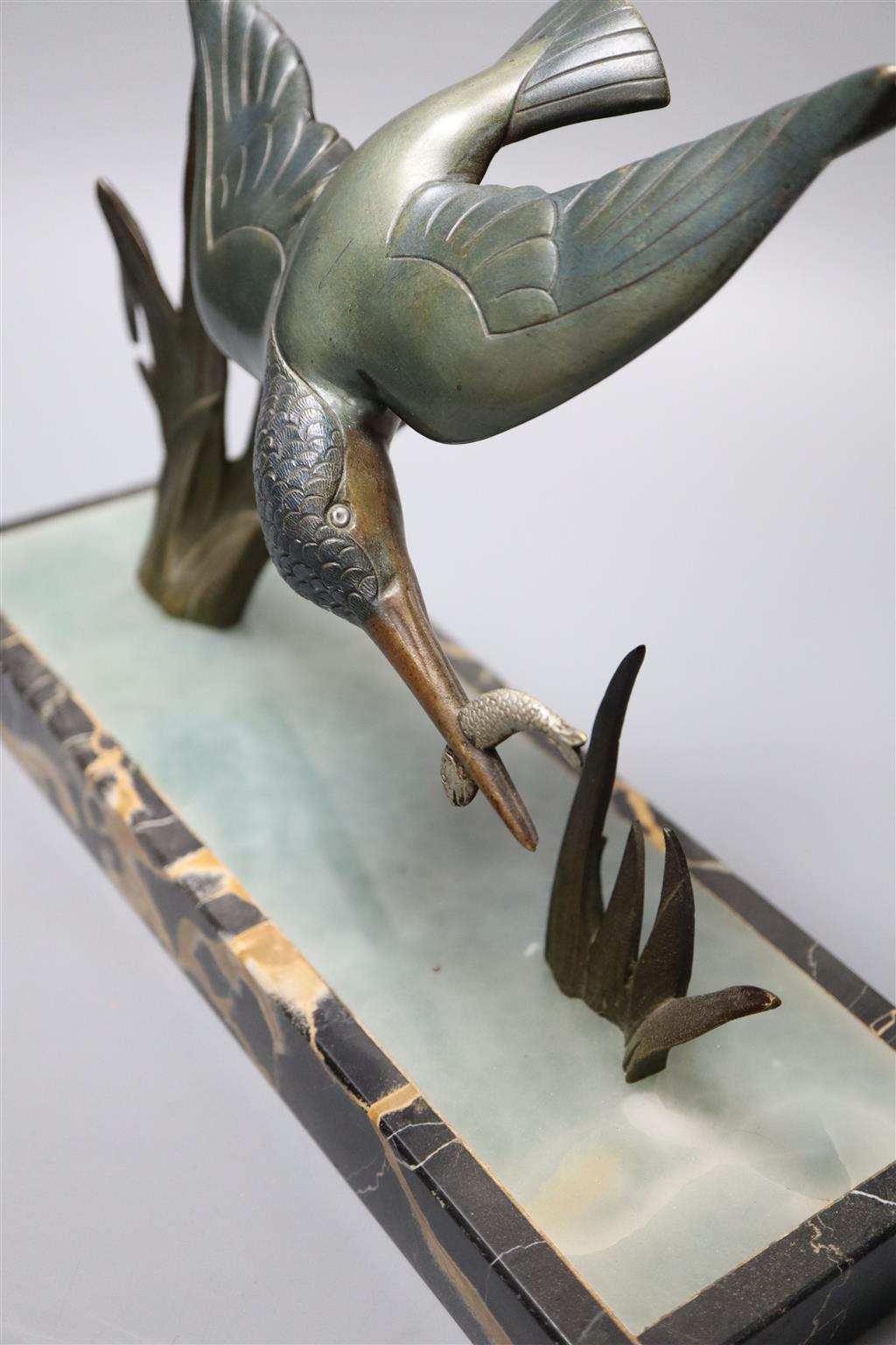 Limousin. An Art Deco bronze kingfisher, on marble plinth, width 30cm